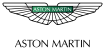 Aston Martin logo: white 'ASTON MARTIN' text on a green rectangular banner against a black background.